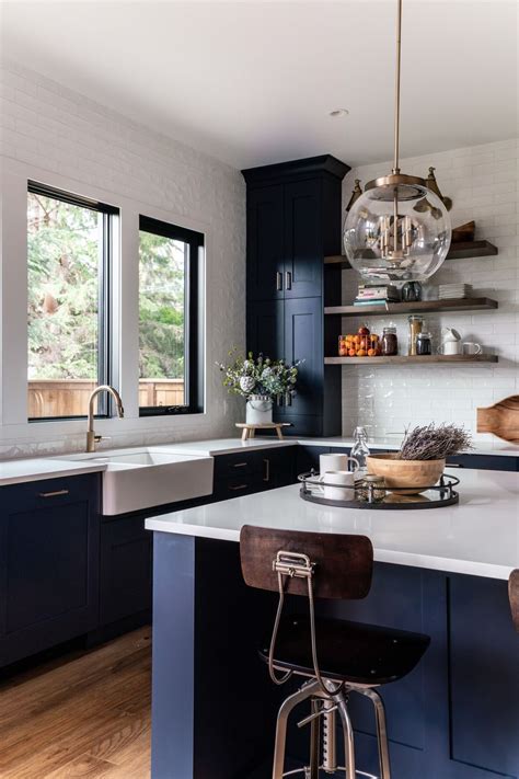 navy cabinets with white countertops.